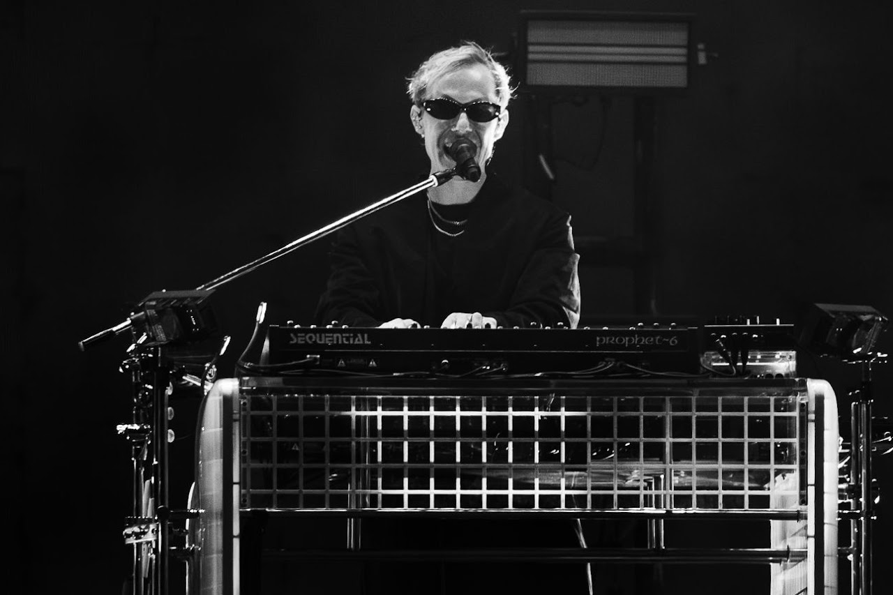 RÜFÜS DU SOL performing under blue light